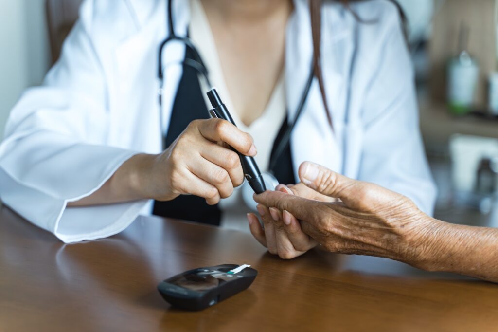Diabetes, nurse. Healthcare, health and medical professional with glucose meter to test insulin leve